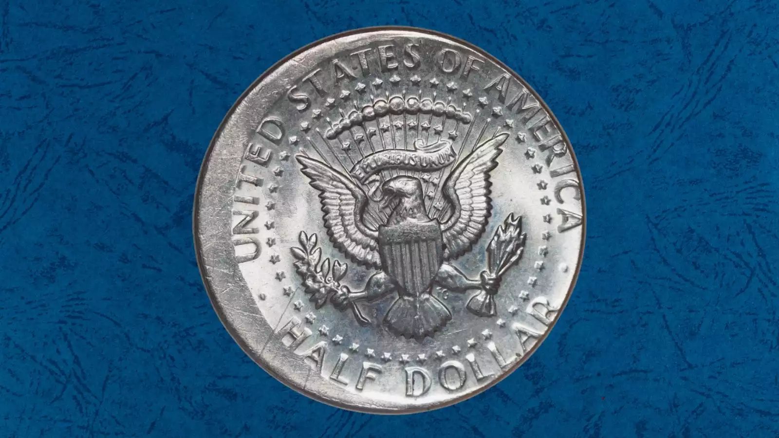 2003 Kennedy half dollar off-center strike error with crescent of blank planchet and visible date